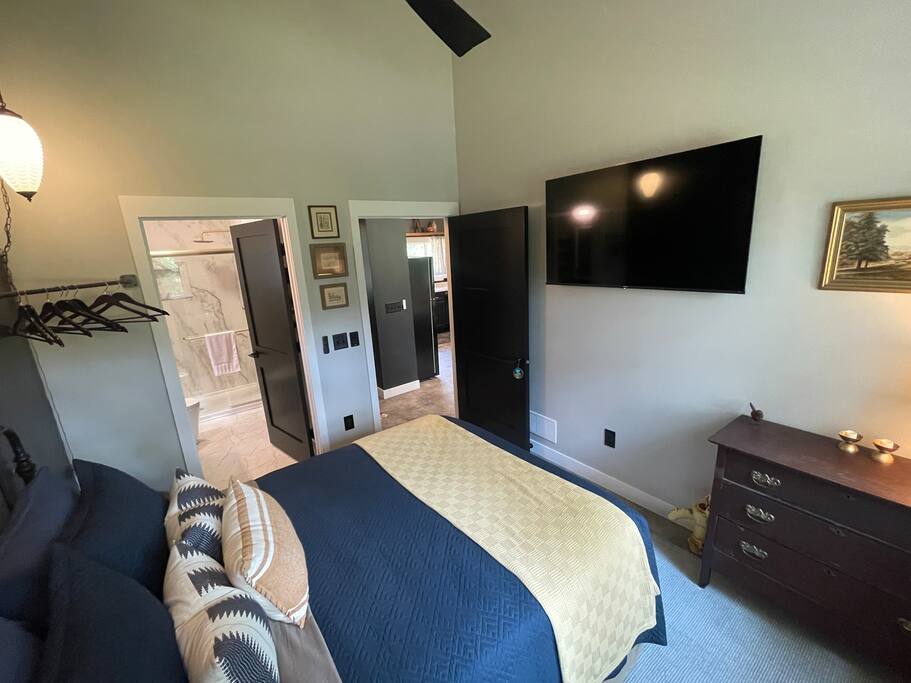 2nd Bedroom with a queen bed, FireTV, dresser, hangers, end table, chair and fan. 2nd bathroom connected to the bedroom with shower, sink, anti-fog /lighted mirror, toilet and hair dryer. 2nd Bedroom with a queen bed, FireTV, dresser, hangers, end table, chair and fan. 2nd bathroom connected to the bedroom with shower, sink, anti-fog /lighted mirror, toilet and hair dryer. - New Listing 2BR/2BA on Trout Lake HotTub & Firepit - Wisconsin Dells