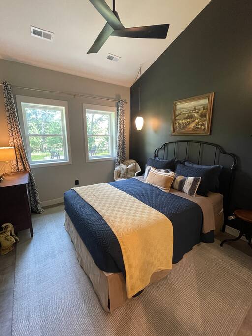 2nd Bedroom with a queen bed, FireTV, dresser, hangers, end table, chair and fan. 2nd bathroom connected to the bedroom with shower, sink, anti-fog /lighted mirror, toilet and hair dryer. 2nd Bedroom with a queen bed, FireTV, dresser, hangers, end table, chair and fan. 2nd bathroom connected to the bedroom with shower, sink, anti-fog /lighted mirror, toilet and hair dryer. - New Listing 2BR/2BA on Trout Lake HotTub & Firepit - Wisconsin Dells