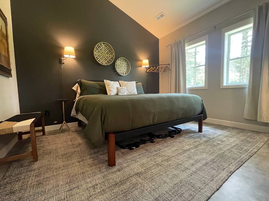 Master Suite Bedroom with a king bed, FireTV, dresser, hangers, end tables, reading lights, bench and 2 luggage folding racks. Master bathroom connected to the bedroom with shower, double sink, anti-fog /lighted mirror, bidet toilet and hair dryer. Master Suite Bedroom with a king bed, FireTV, dresser, hangers, end tables, reading lights, bench and 2 luggage folding racks. Master bathroom connected to the bedroom with shower, double sink, anti-fog /lighted mirror, bidet toilet and hair dryer. - New Listing 2BR/2BA on Trout Lake HotTub & Firepit - Wisconsin Dells