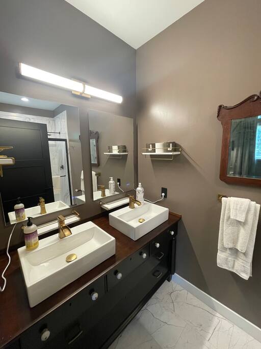 Full bathroom with stand up shower, bidet toilet, double sink with vanity, shower gel, conditioner, shampoo, and towels supplied. Full bathroom with stand up shower, bidet toilet, double sink with vanity, shower gel, conditioner, shampoo, and towels supplied. - New Listing 2BR/2BA on Trout Lake HotTub & Firepit - Wisconsin Dells