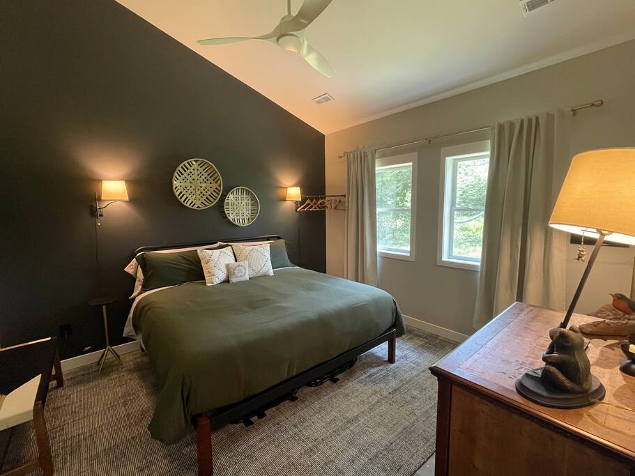 Master Suite Bedroom with a king bed, FireTV, dresser, hangers, end tables, reading lights, bench and 2 luggage folding racks. Master bathroom connected to the bedroom with shower, double sink, anti-fog /lighted mirror, bidet toilet and hair dryer. Master Suite Bedroom with a king bed, FireTV, dresser, hangers, end tables, reading lights, bench and 2 luggage folding racks. Master bathroom connected to the bedroom with shower, double sink, anti-fog /lighted mirror, bidet toilet and hair dryer. - New Listing 2BR/2BA on Trout Lake HotTub & Firepit - Wisconsin Dells