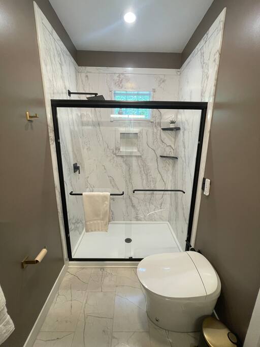 Full bathroom with stand up shower, bidet toilet, double sink with vanity, shower gel, conditioner, shampoo, and towels supplied. Full bathroom with stand up shower, bidet toilet, double sink with vanity, shower gel, conditioner, shampoo, and towels supplied. - New Listing 2BR/2BA on Trout Lake HotTub & Firepit - Wisconsin Dells