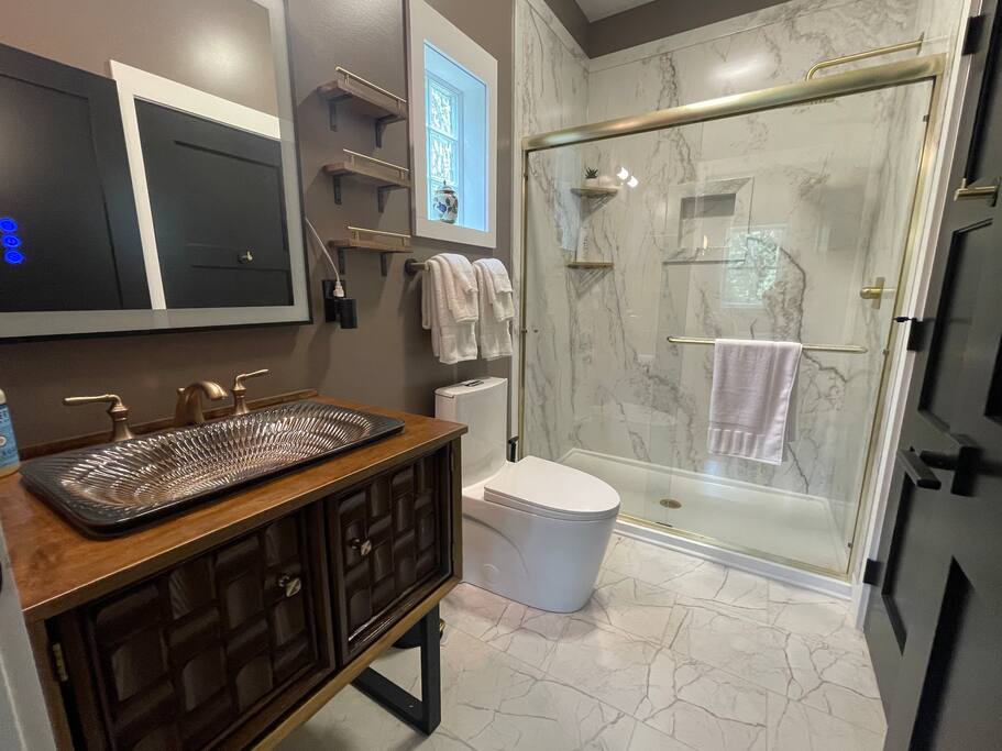 Full bathroom with stand up shower, toilet, sink with vanity, shower gel, conditioner, shampoo, and towels supplied. Full bathroom with stand up shower, toilet, sink with vanity, shower gel, conditioner, shampoo, and towels supplied. - New Listing 2BR/2BA on Trout Lake HotTub & Firepit - Wisconsin Dells