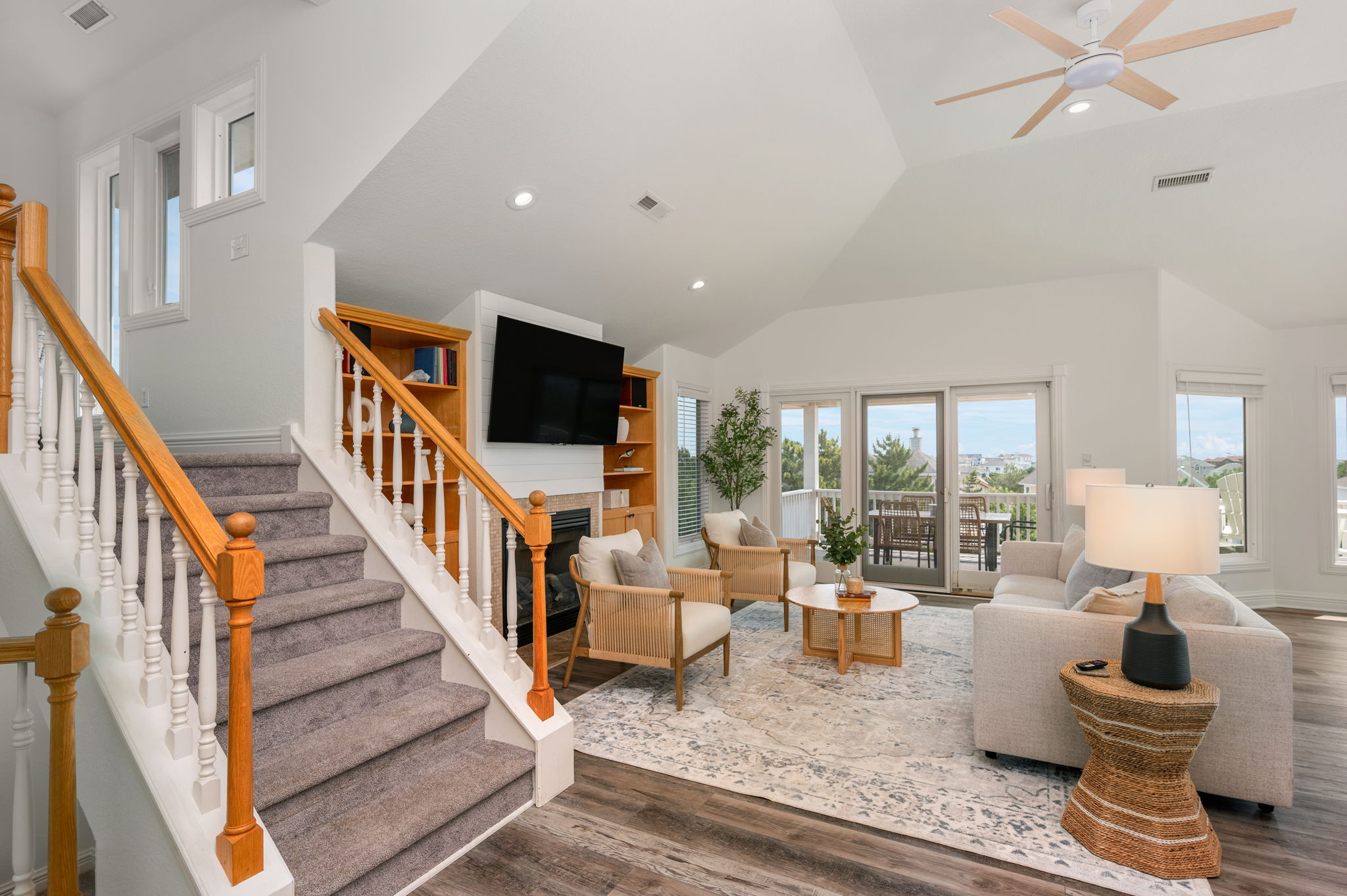 Third Level Living Room With stairs up to Captains Watch, Kick back and have family TV time on the Smart TV