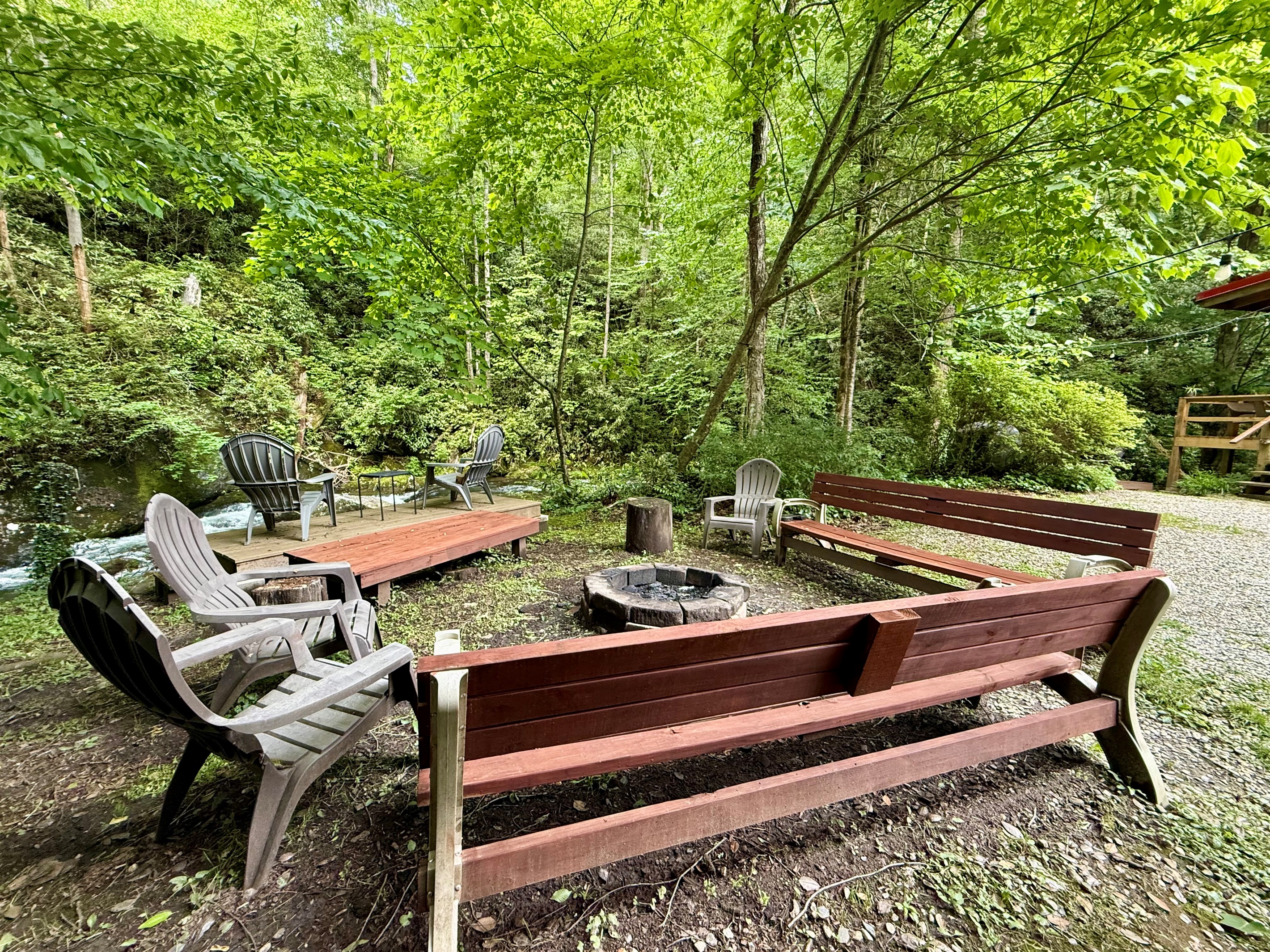 A fire pit worth gathering around—day or night. A fire pit worth gathering around—day or night. - Buffalo Creek Log Cabin - Robbinsville