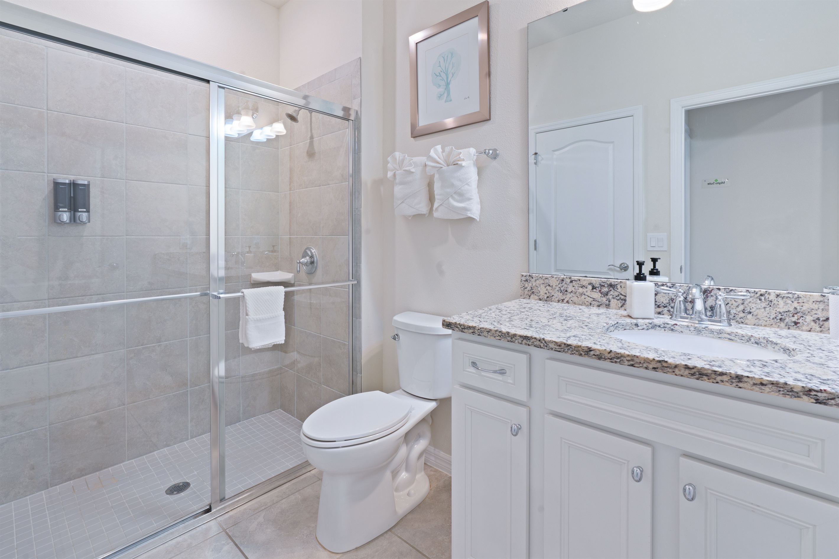 Downstairs ensuite bathroom with body wash, shampoo, conditioner, hand soap, hairdryer in every bathroom for your convenience.