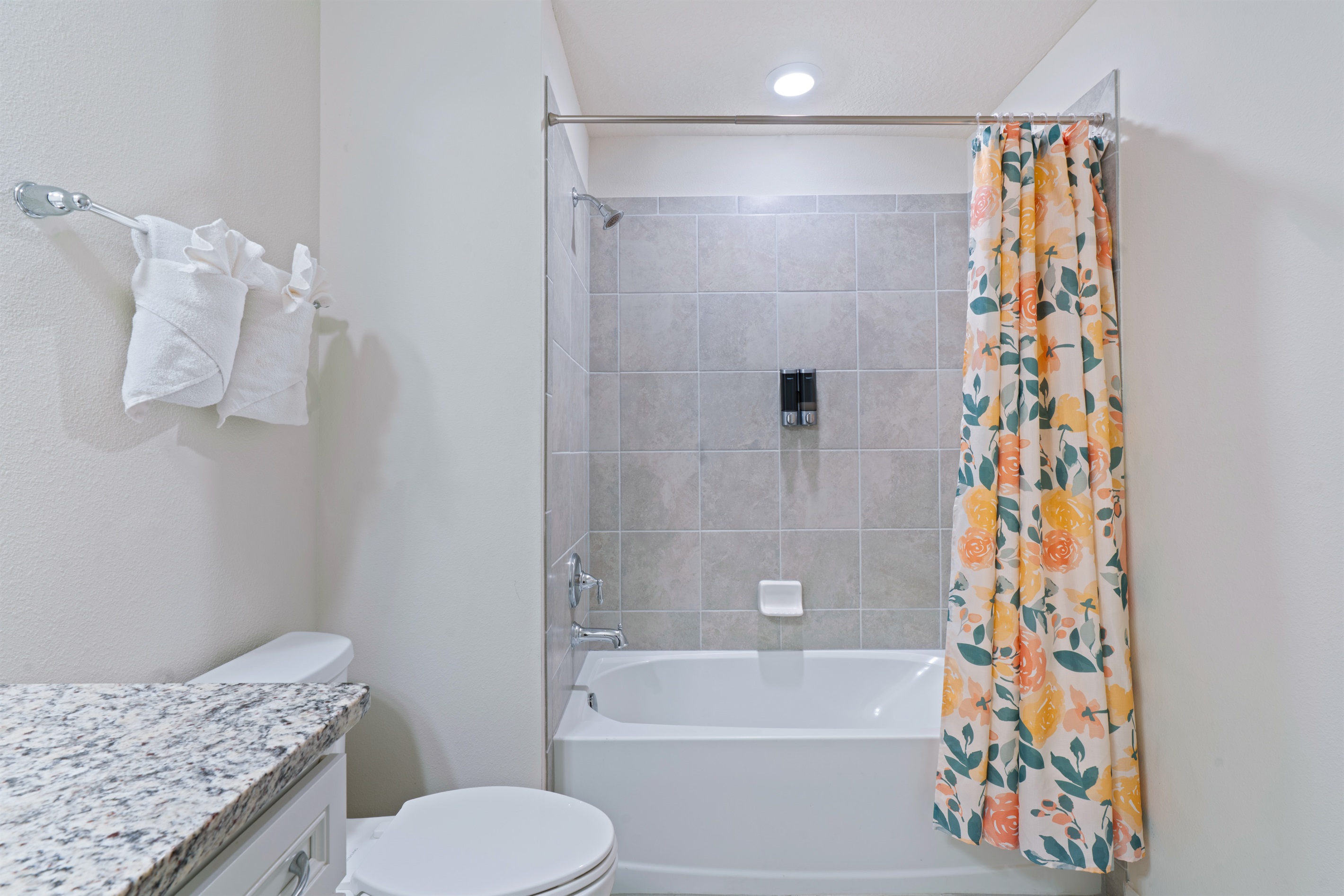 Family-friendly bathroom with a shower/tub combo—ideal for kids and designed with comfort and convenience in mind.