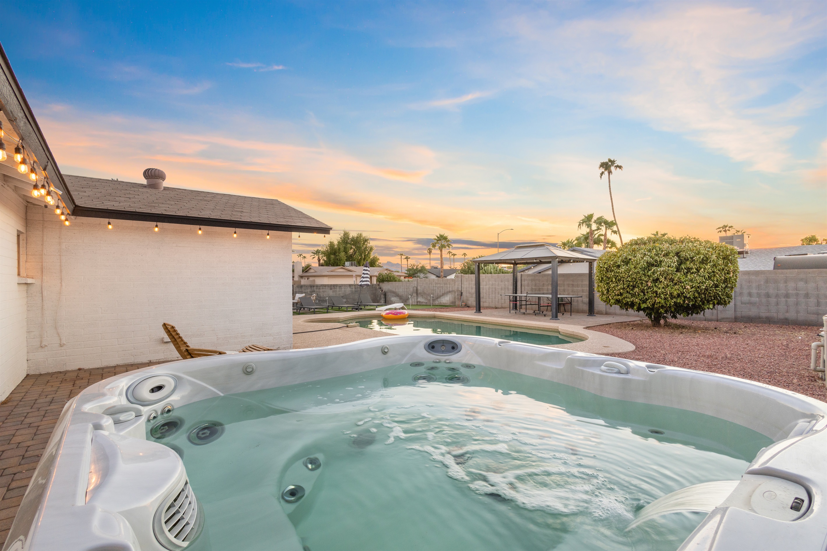 Hot tub with views of pool and Arizona sunset