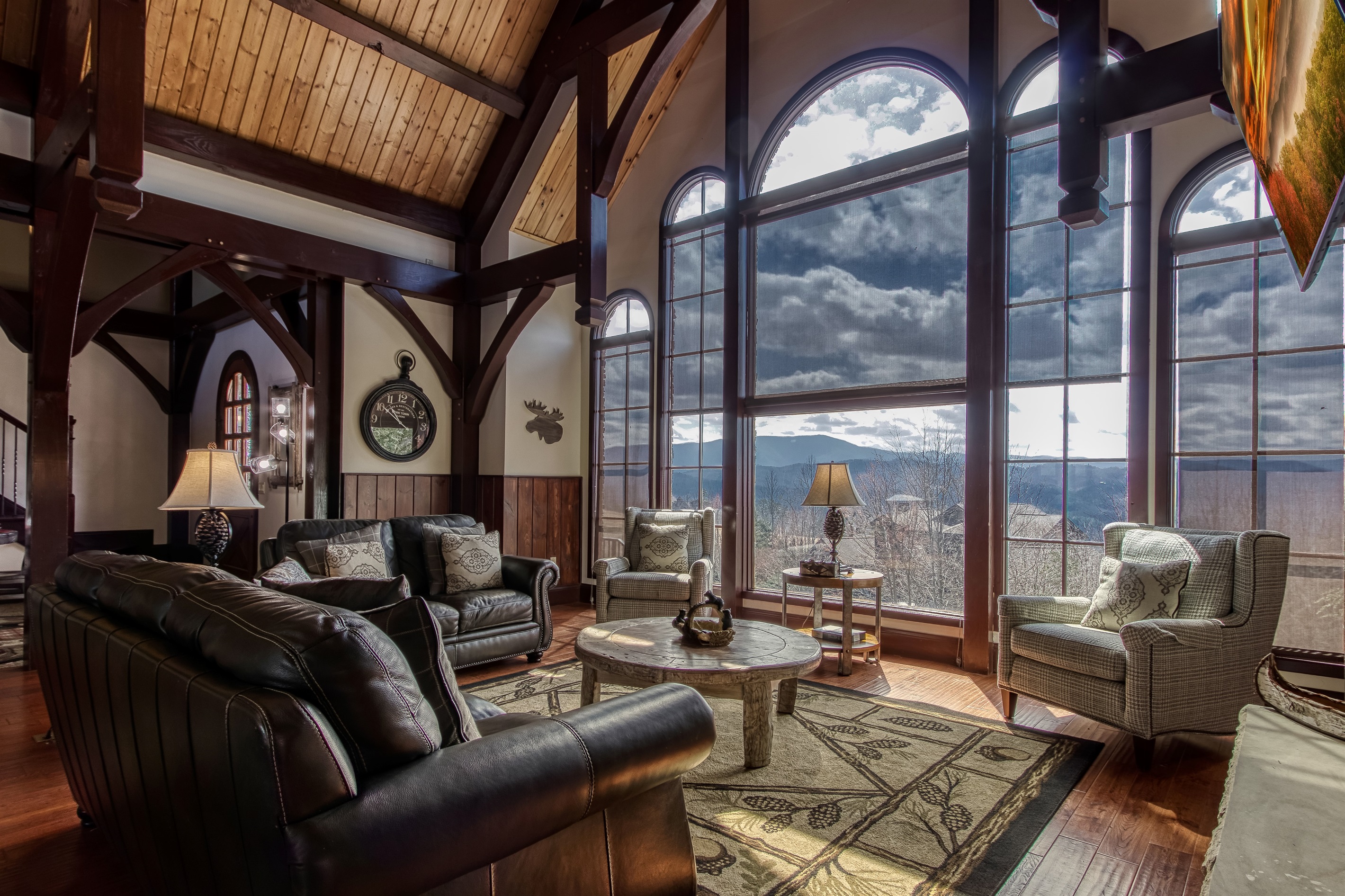 Living room featuring a fireplace and large TV, and of course, stunning mountain views!
