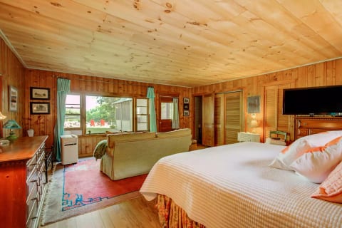 Master bedroom is spacious with lake view.