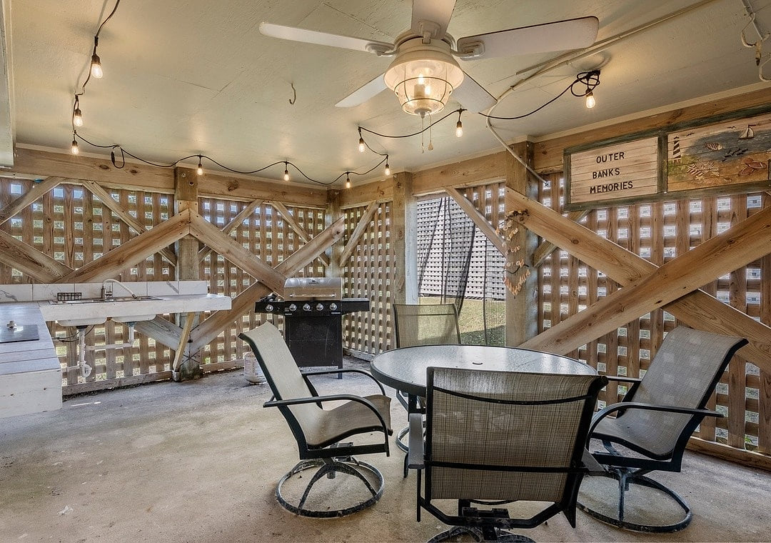 Outdoor Retreat: Enjoy al fresco dining and grilling in this charming, shaded space!
