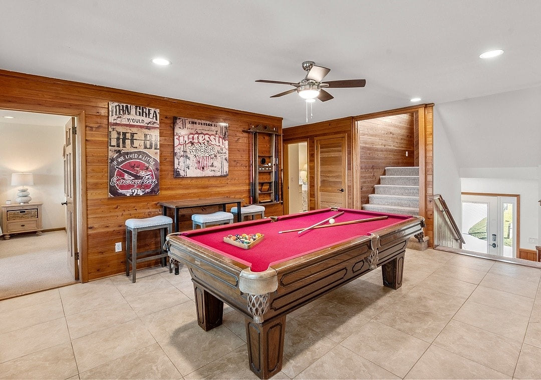 Unwind with friends over a game of pool and a splash of vibrant decor Luxury Waterfront Paradise 