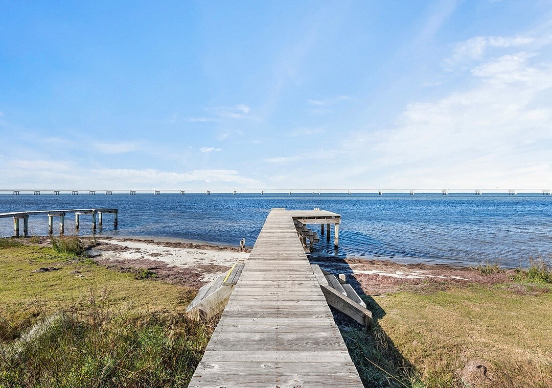 Waterfront Retreat: Stroll down the private dock to breathtaking views and serene waters!