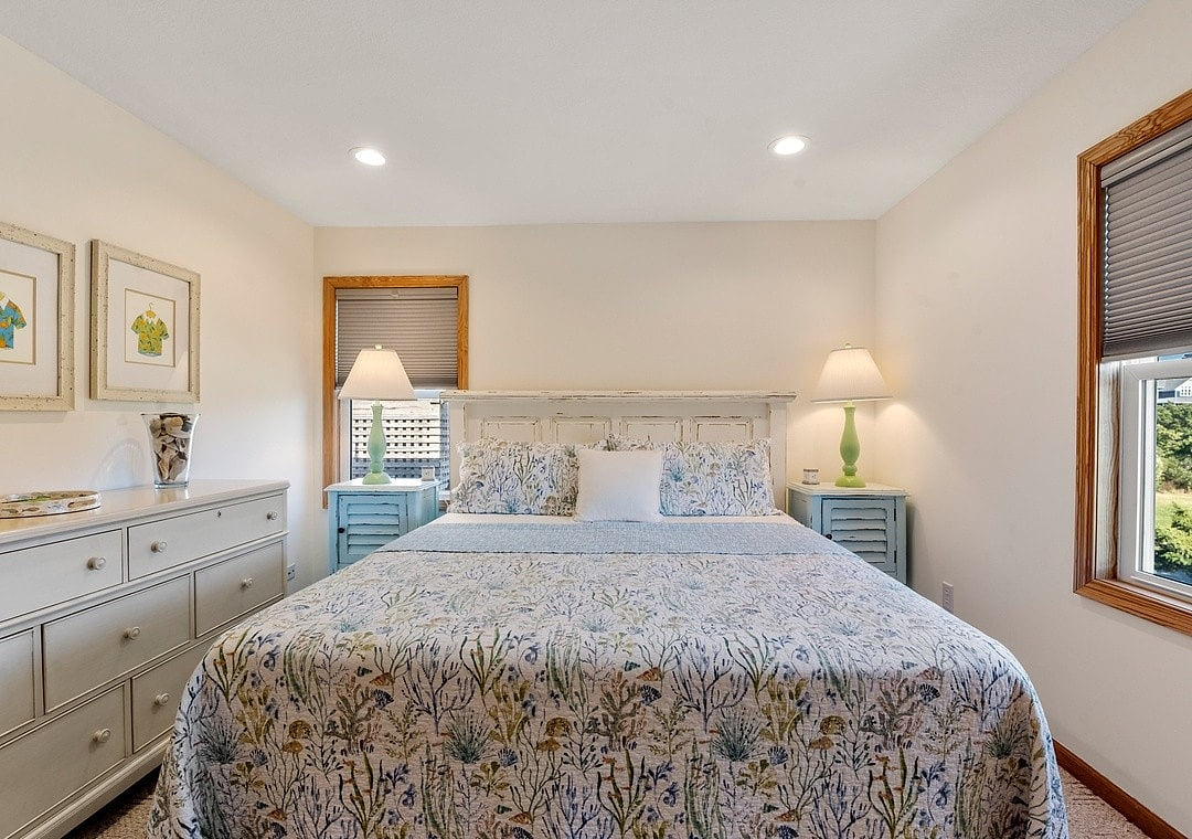 Bedroom Retreat: Bright decor and serene views create the perfect spot for relaxation!
