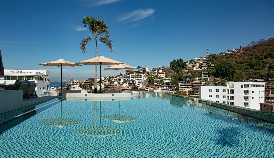 D'Vine is a stunning, state-of-the-art building just a 5-minute stroll from the beach, located in the vibrant heart of Puerto Vallarta's Romantic Zone, where modern luxury meets coastal charm.