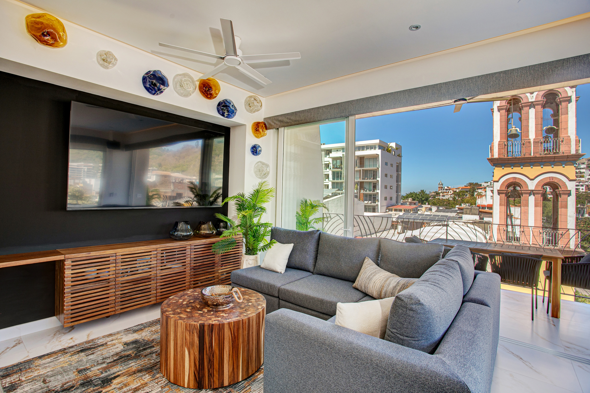 Relax in the spacious living room with an 86" TV and sliding doors that open to a refreshing breeze.