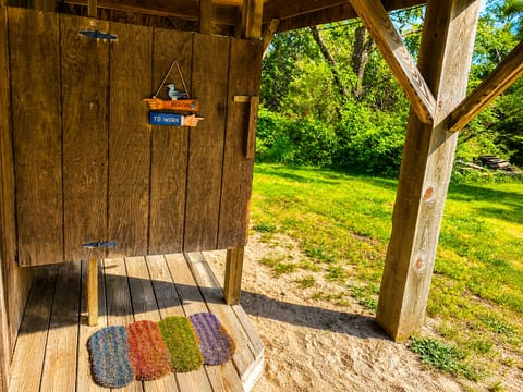 Rinse off in your private outdoor shower—tucked behind the home with hot and cold water, overhead lighting, and plenty of provacy. This convenient, open-air space is yours after beach days (seasonal).