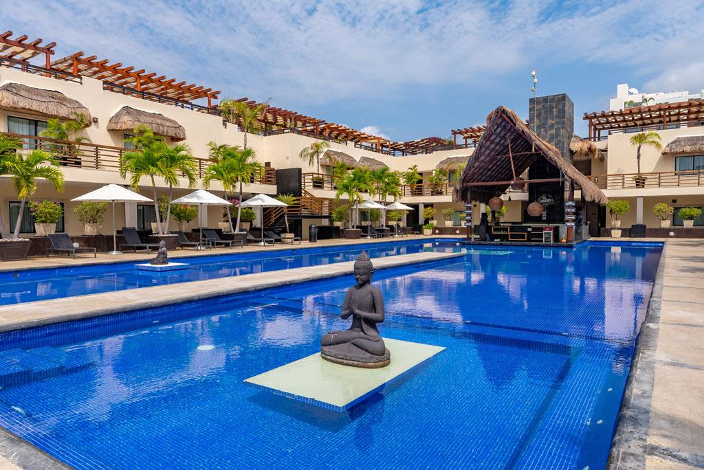 Welcome to your tranquil oasis. The stunning, resort-style pool is the soul of the complex, offering a chic and serene atmosphere that blends Mexican Caribbean style with Thai-inspired tranquility. Find your favorite sun lounger and soak in. Oceanfront Retreat Aldea Thai at Mamitas Beach/5th