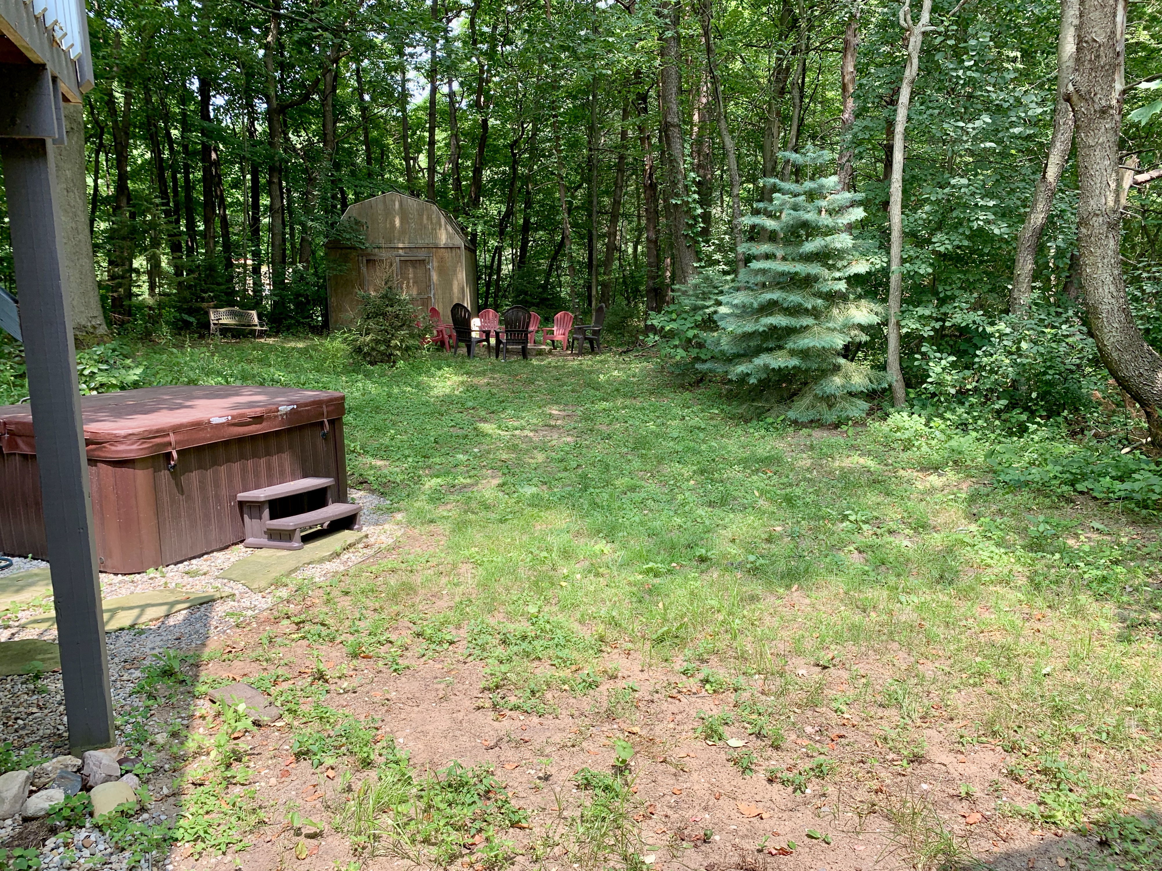 View of hot tub and back yard