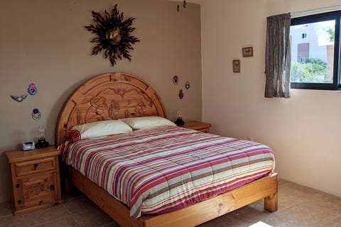 Queen and twin beds in the sunset room on the upper floor