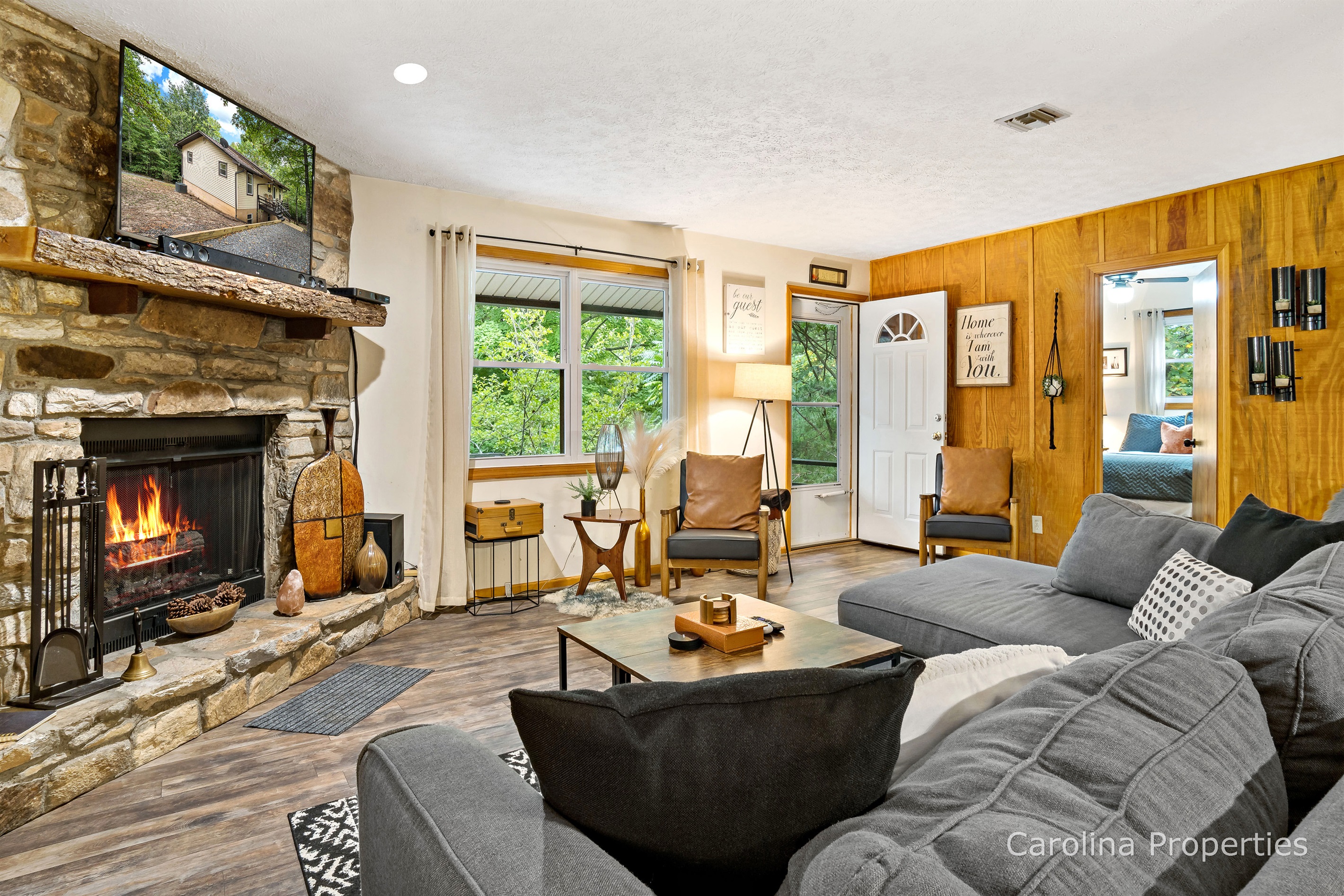 Large, stone gas log fireplace in the livingroom