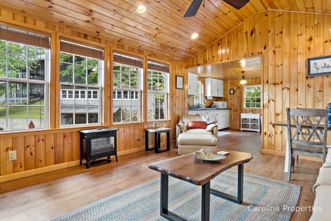 Windows line the wall offering views of Lake Lure