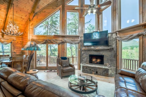Main level living room with gas log fireplace and amazing view