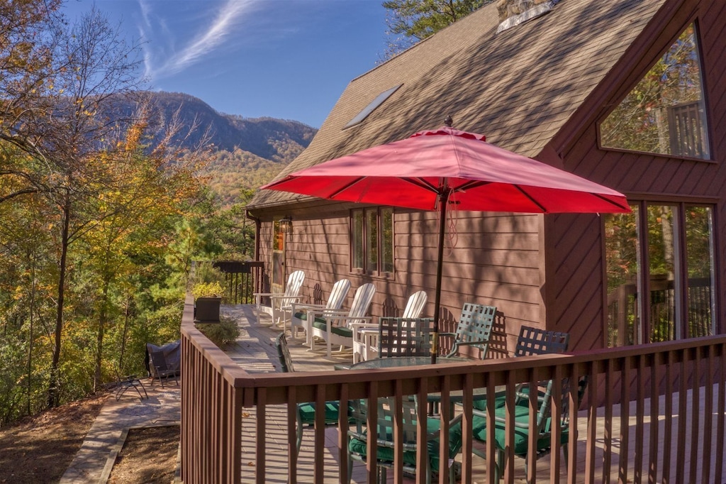 Outside deck also has a table and chairs with umbrella for outside dining