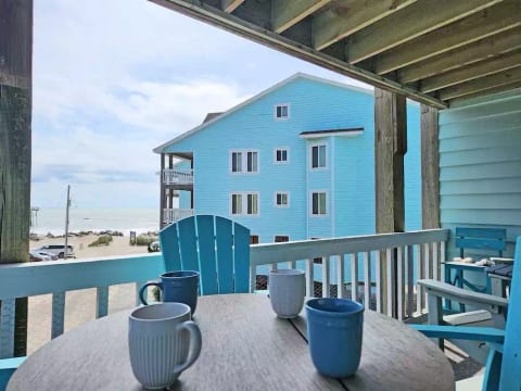 Morning coffee on porch watching the ocean and surfers