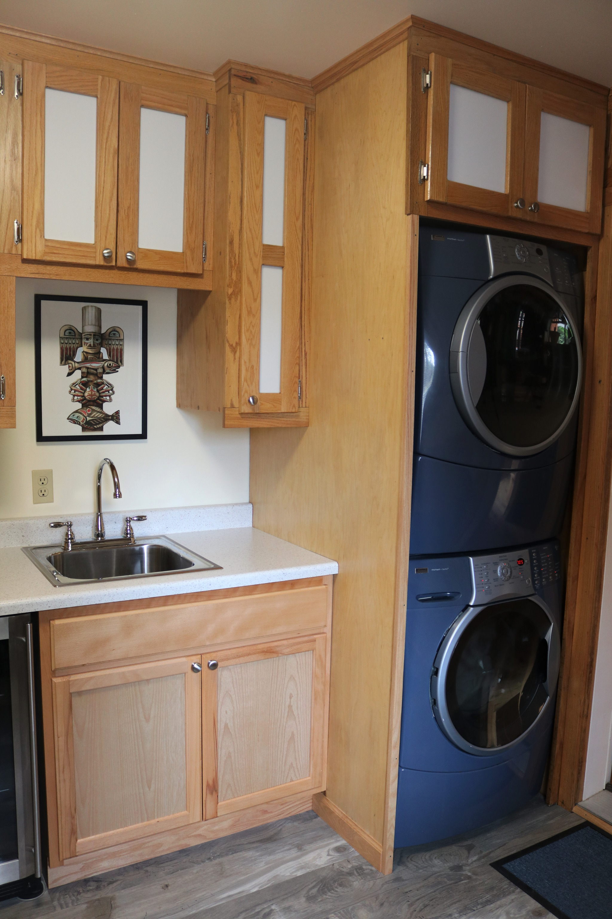 Laundry room between the Main  house and Garage is a shared space!  Washer/Dryer , dvd library and small honor store