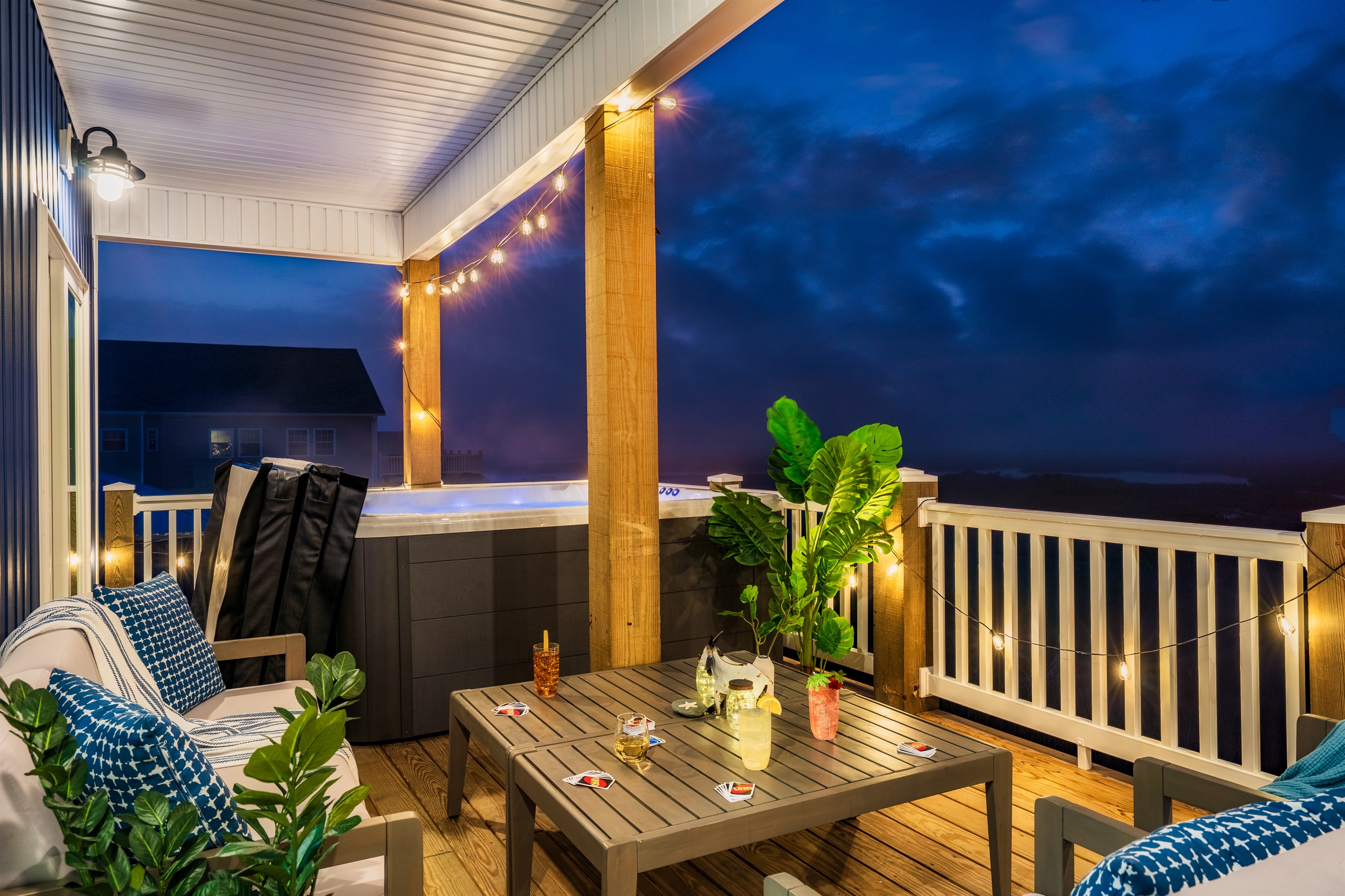 Relax on our back deck, featuring a luxurious hot tub and sweeping marsh views