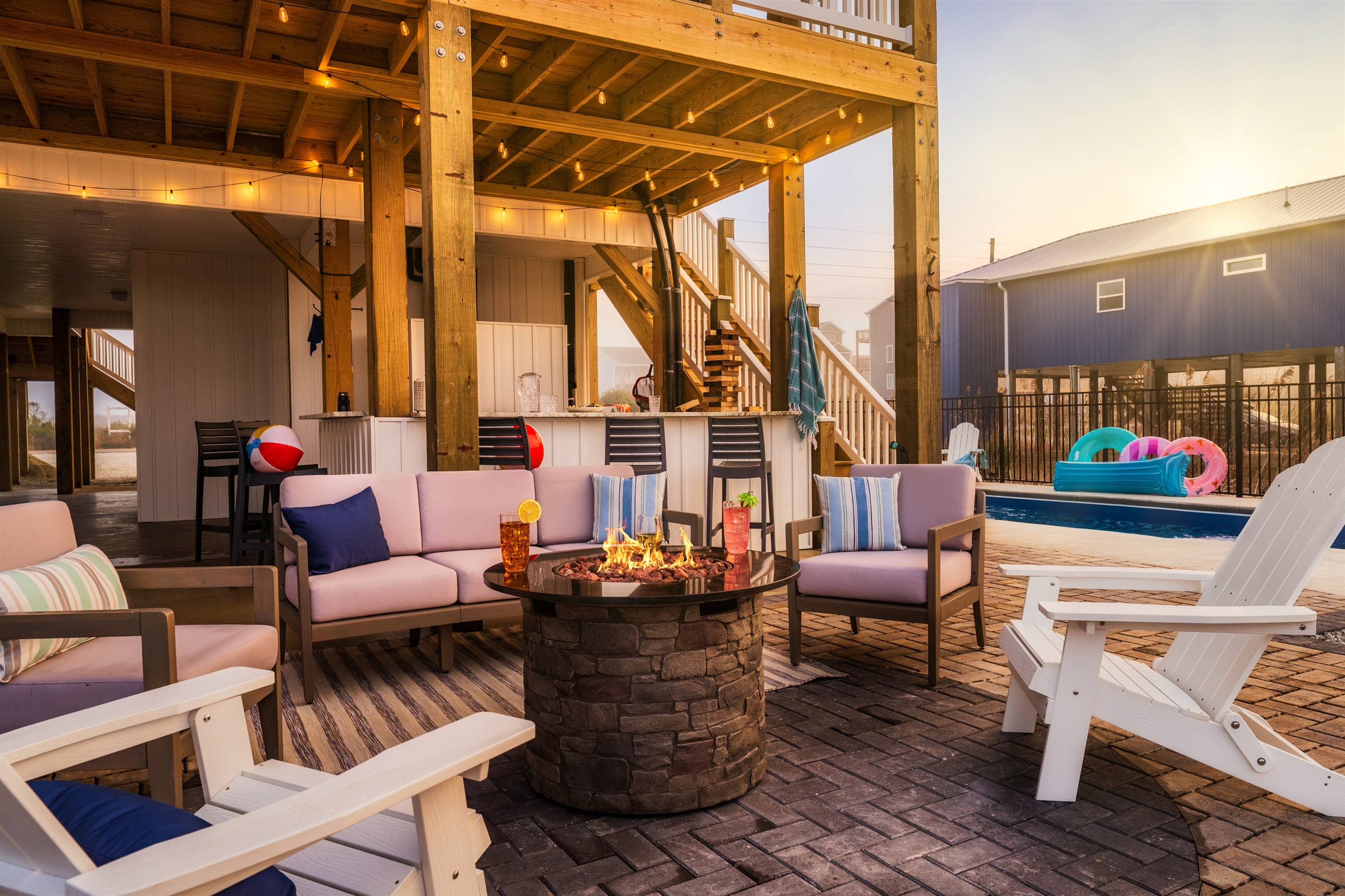 Experience the perfect blend of warmth and refreshment with our inviting fire pit.  Check out more cool photos and videos of the house on our IG @CushyCoastHouse