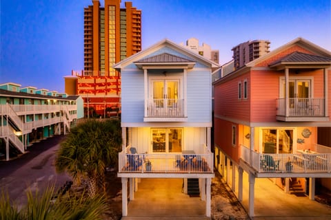 Twilight enchantment meets coastal charm in these glowing beachfront gems! The cozy interior lights beckon after a day of sun-soaked adventures, while spacious decks offer intimate stargazing spots.