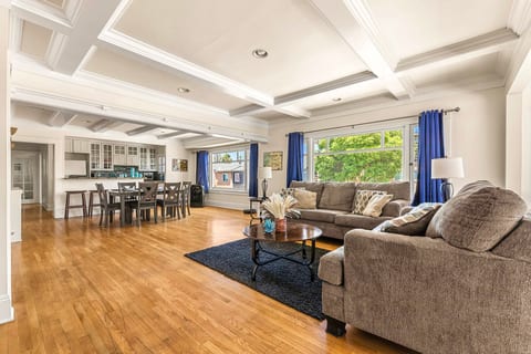 Cozy living room with two comfy couches perfect for relaxing. Enjoy movie nights on the large TV or unwind after a day of exploring. Bright, inviting space with plenty of room to gather, chat, or kick back in comfort. Ideal for families or friends!
