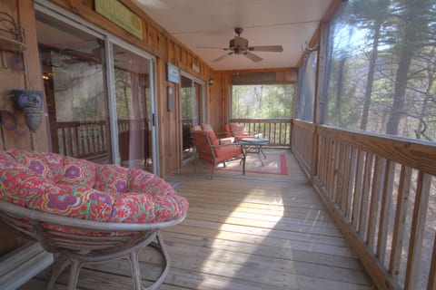 Screened-in porch where you can hang out with family and friends
