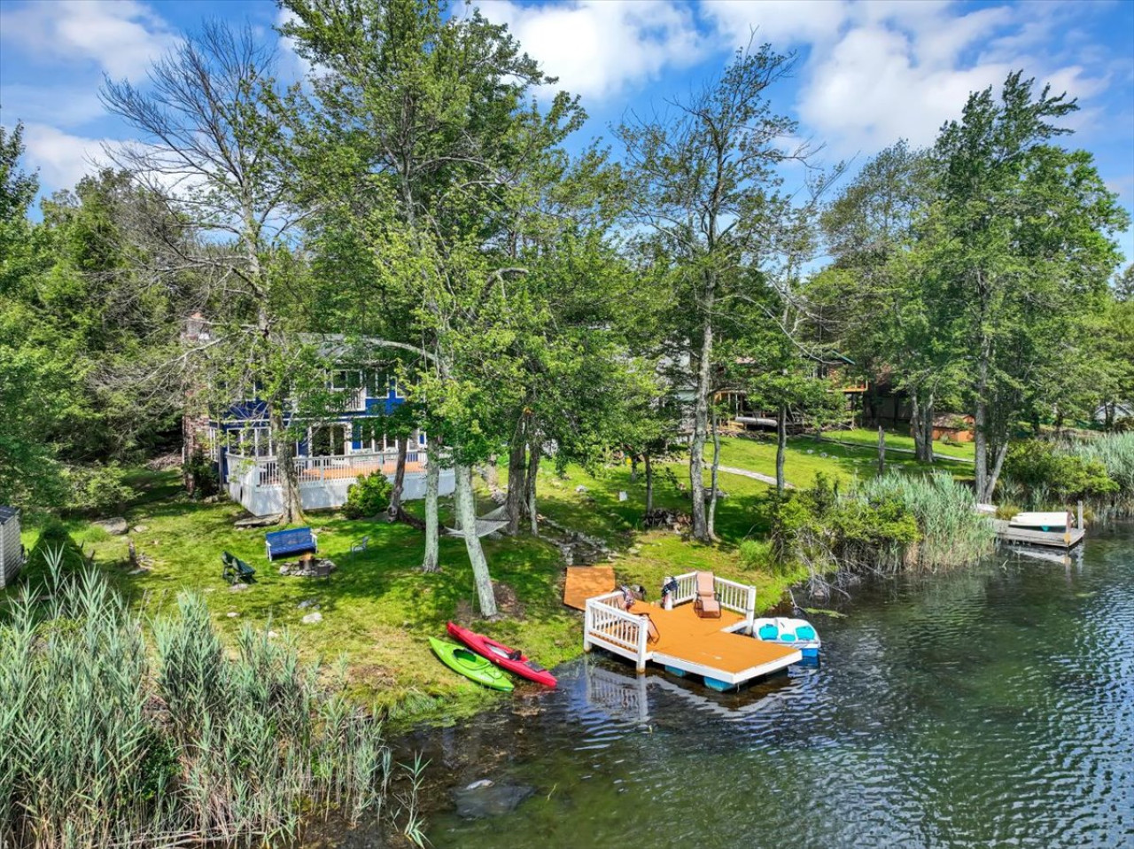 Private dock, kayaks, and paddle boat right in the backyard—everything you need for a relaxing or active lake day.