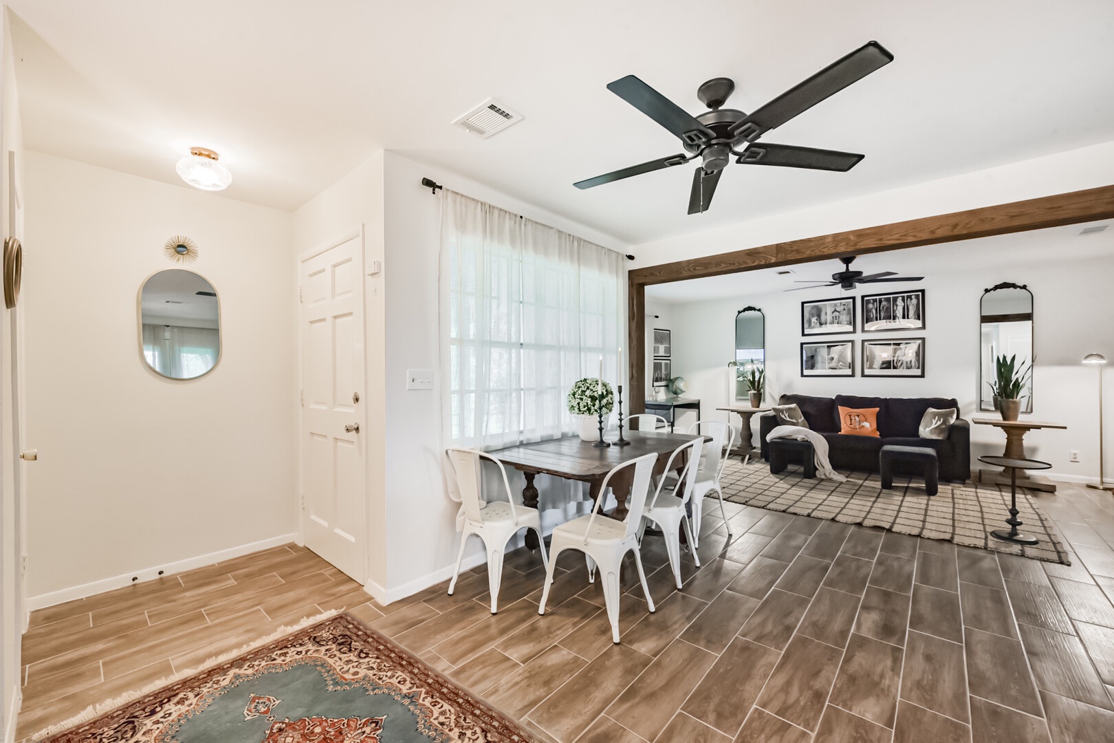 Entry way into the home where you are greeted with a warm inviting open concept living room, breakfast table and large kitchen