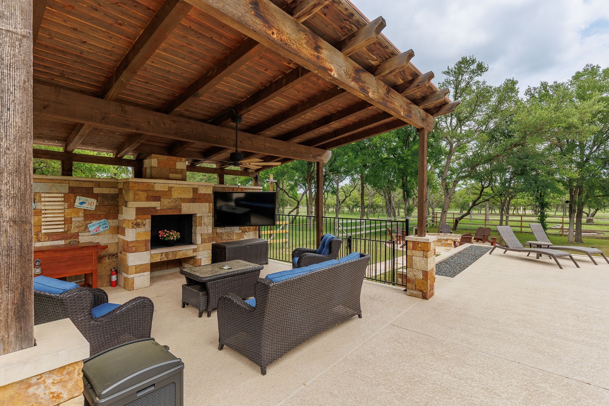 Cabana with outdoor seating and TV