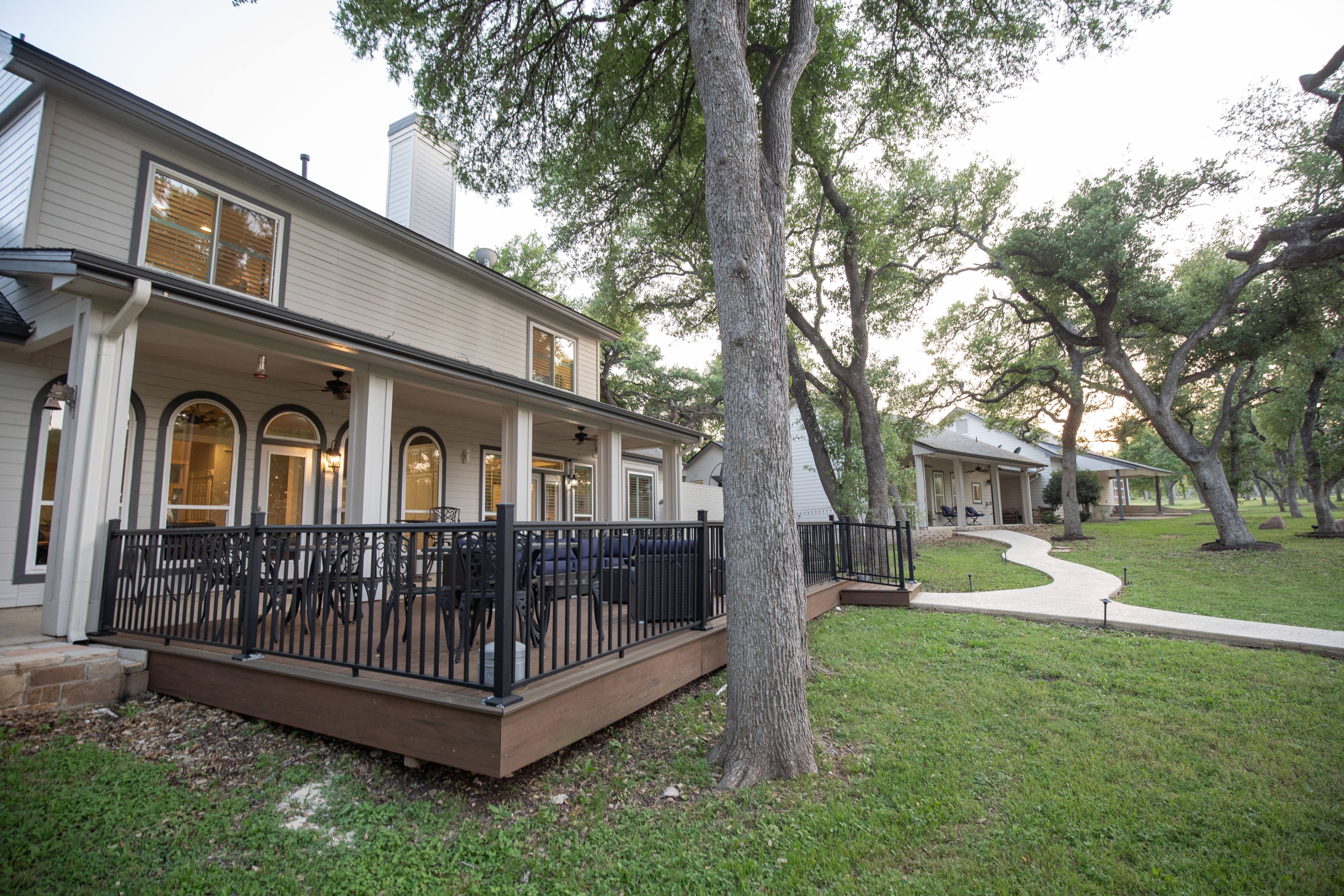 Main house -  large deck overlooking the pool and cabana with large sectional sofa, 3 tables with seating for 12, bistro table, high top table, propane grill, hammock, outdoor shower and ceiling fans 
