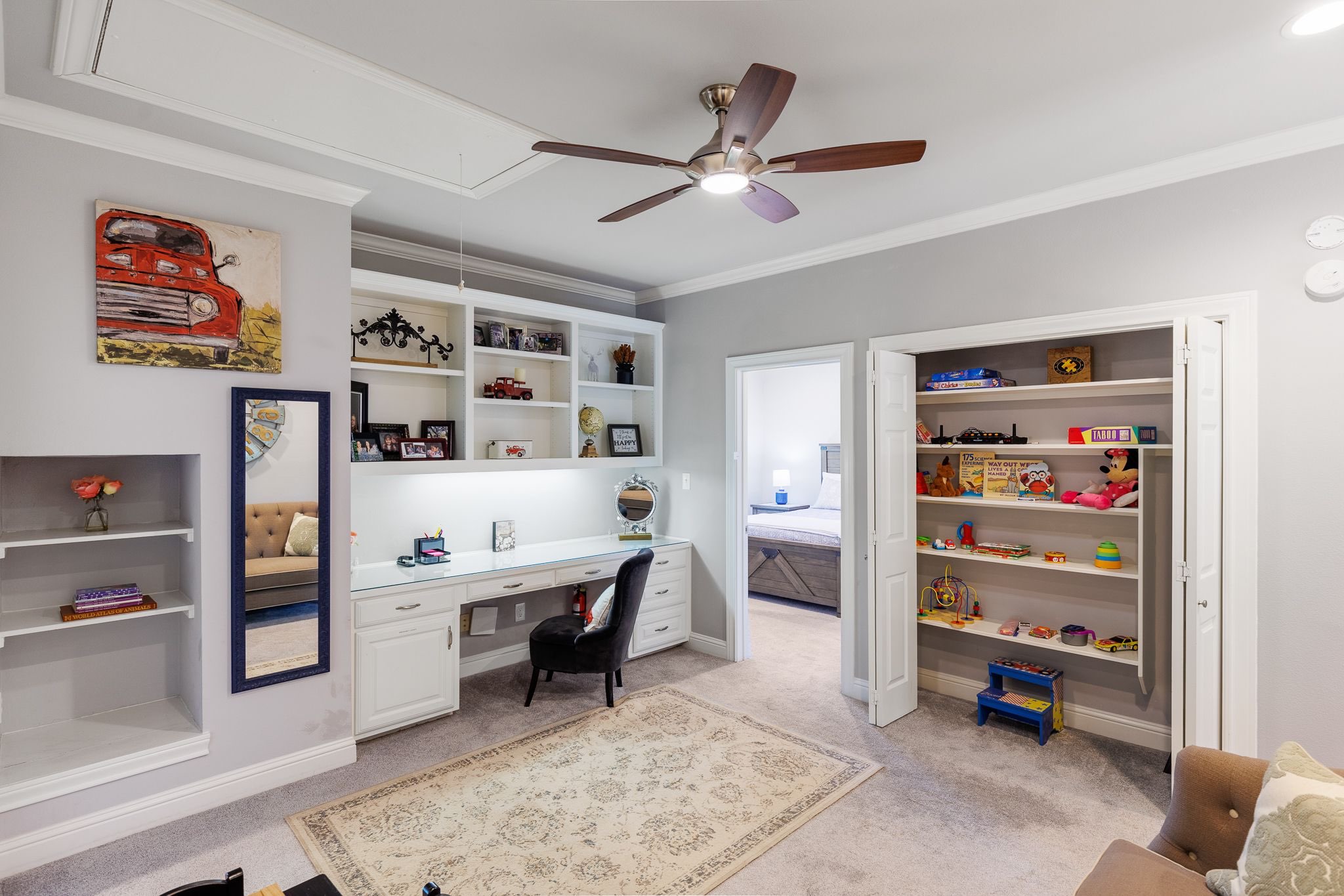 Main house common area with desk and children's toys