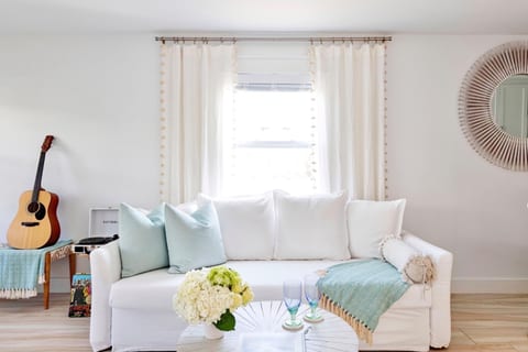Life’s luxuries: High speed internet, 65” smart TV, Bose speaker, Victrola, house guitar, and a cozy work-from-home space!