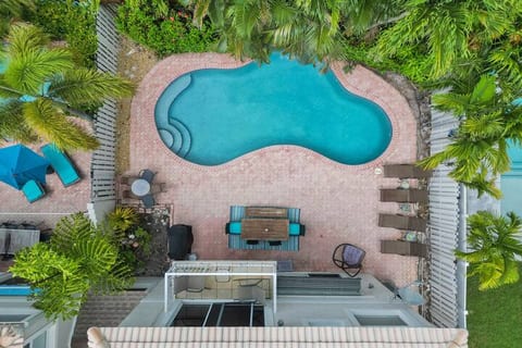 Aerial view of Villa Pine pool area. Gas and charcoal grills