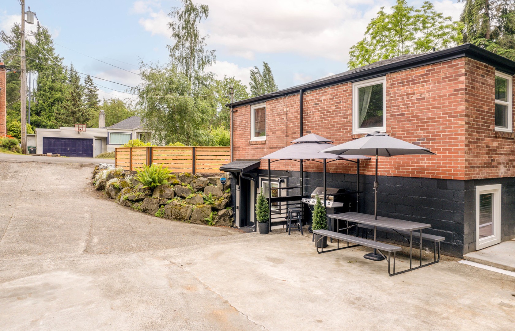 Enjoy plenty of driveway parking. Step outside to a full view of your lower entry, a second BBQ for outdoor meals, and a peaceful setting perfect for relaxation.