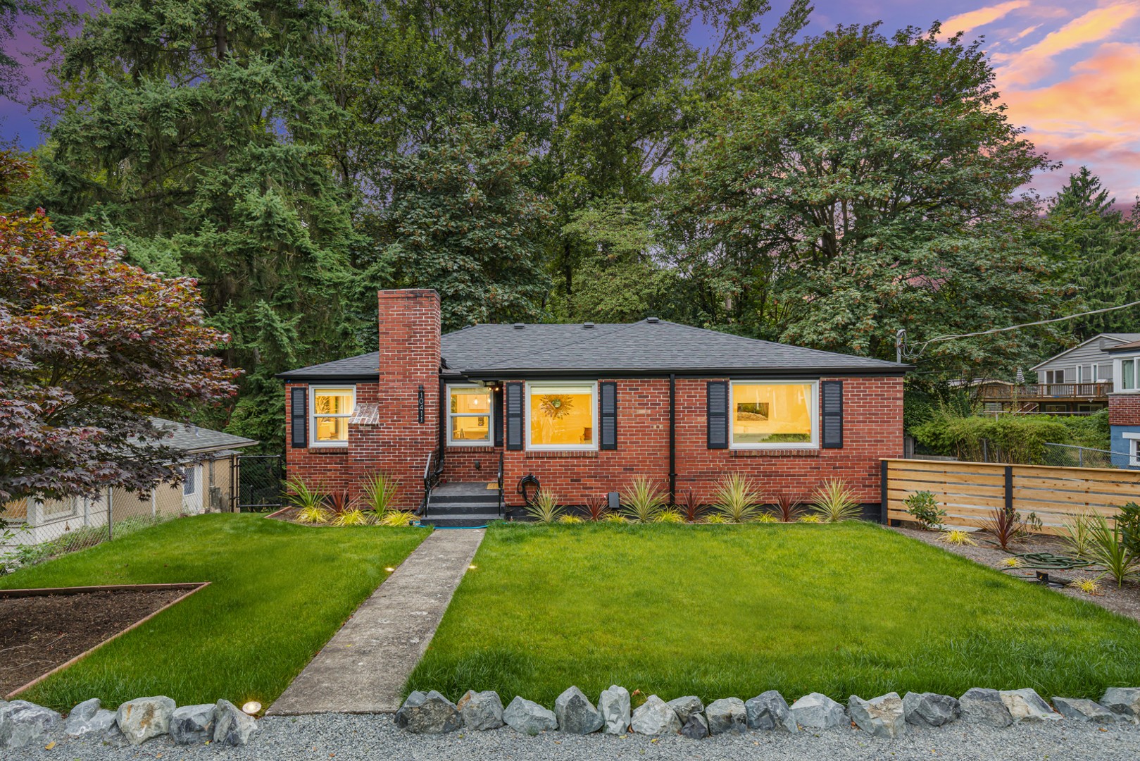 Beautifully landscaped front yard and driveway with ample parking space