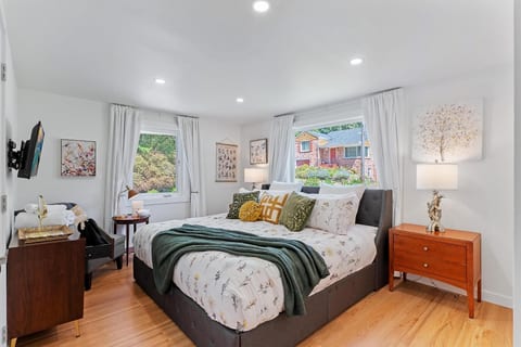 - Spacious bedroom with plush king bed and soft natural light
- Modern décor blends comfort with refreshing garden views
- Wake up to a peaceful stay with cozy linens and restful vibes