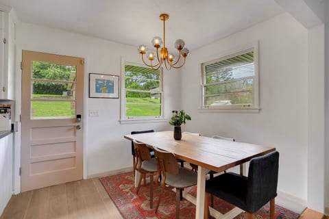 Sleek, modern dining table with minimalist design — perfect for casual meals or gathering with friends and family in a clean, stylish setting.