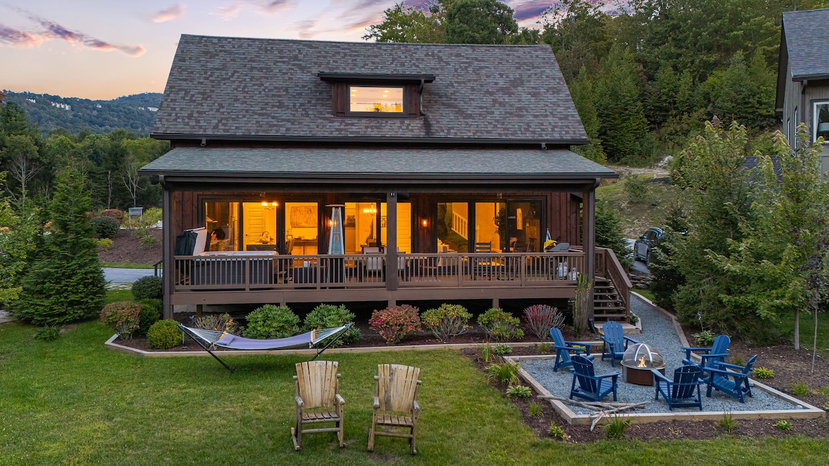 Welcome to your relaxing mountain home away from home. Twilight view of the backyard including fire pit, hammock rockers and our back deck