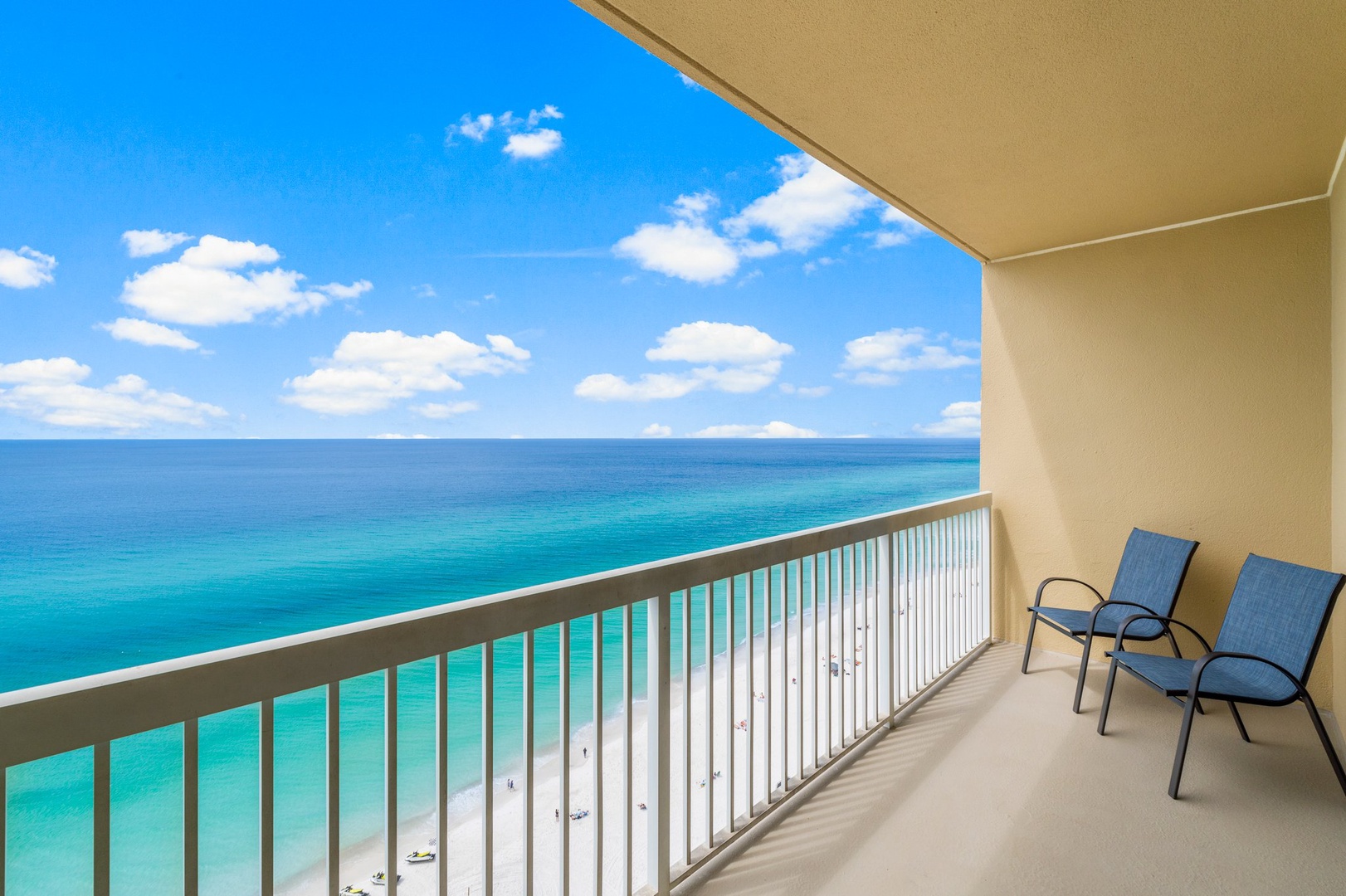 Breathtaking views from a private beachfront balcony with Adirondack chairs for the perfect spot to relax and enjoy the scenery.