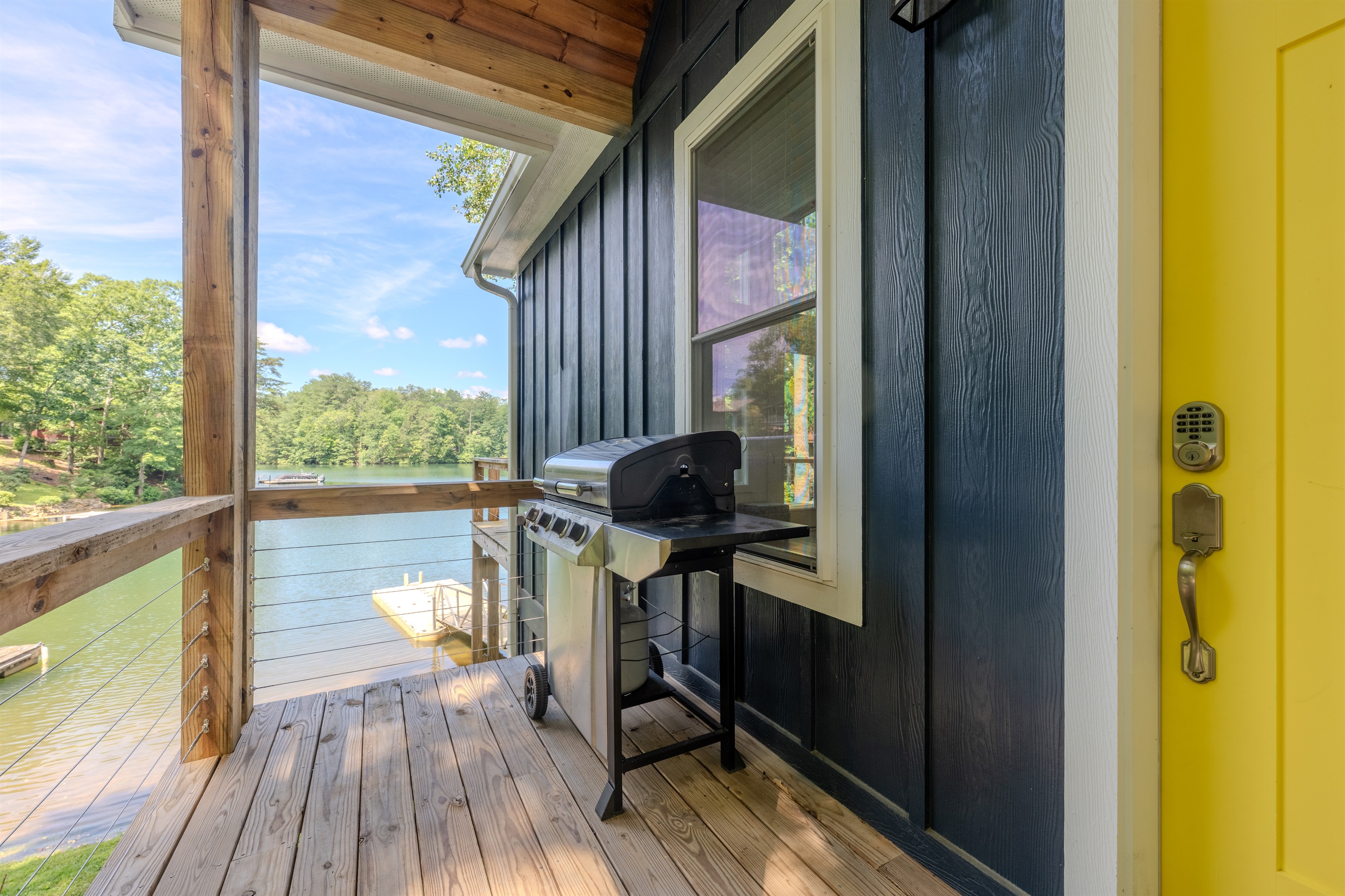 Main level- Deck with lake views, covered porch, and gas grill Main level- Deck with lake views, covered porch, and gas grill - Lakey McLakehouse - Robbinsville