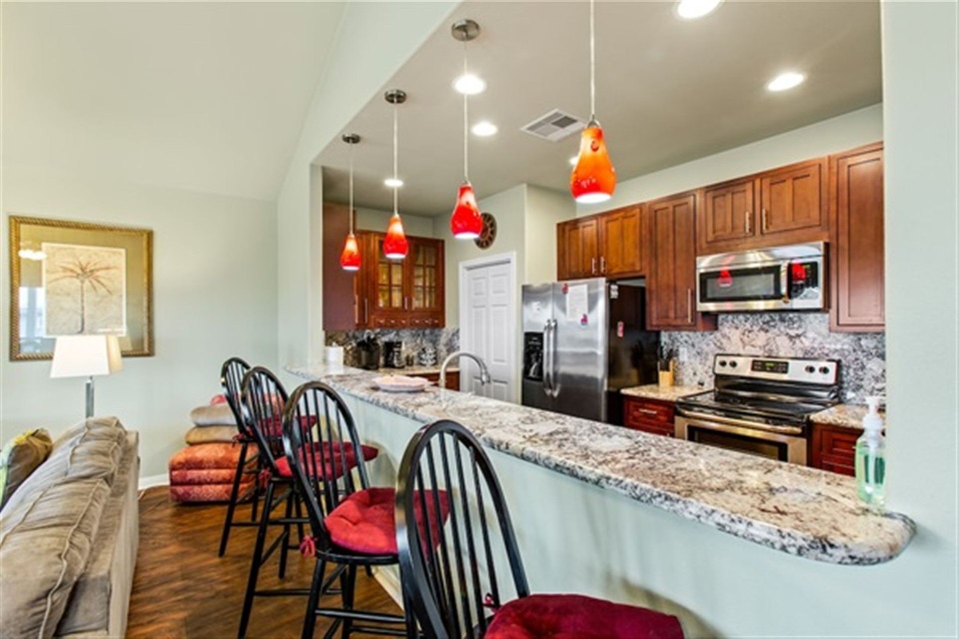 This breakfast bar is the perfect stage for morning coffee and easy conversation, while the kitchen is where family recipes come alive with love and warmth. Coral Breeze